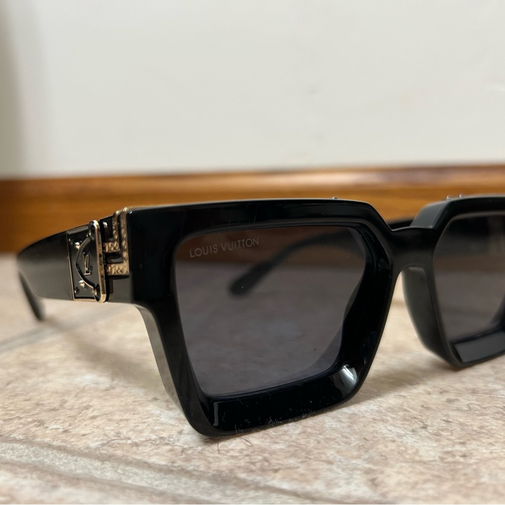 Louis Vuitton Black Sunglasses with Gold Detail
Millionaire
